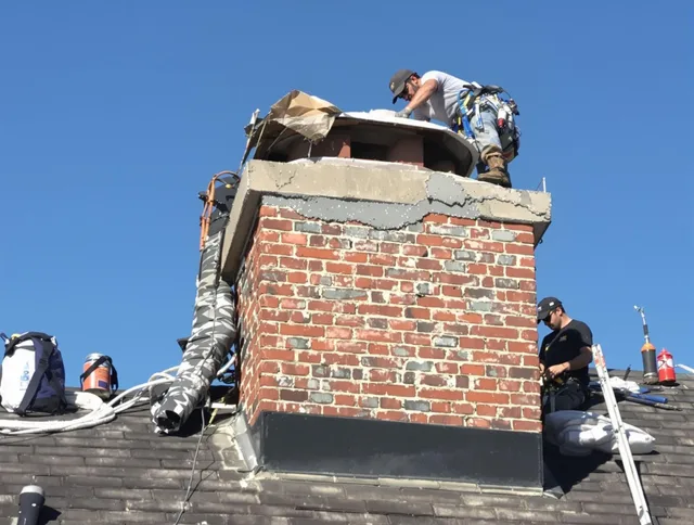 Plantation Chimney Sweep installing a custom chimney crown in Plantation, FL