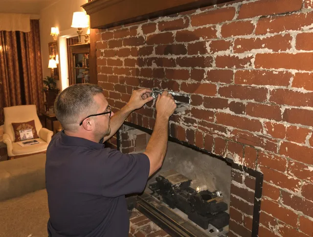 Plantation Chimney Sweep expert fixing a fireplace in Plantation, FL